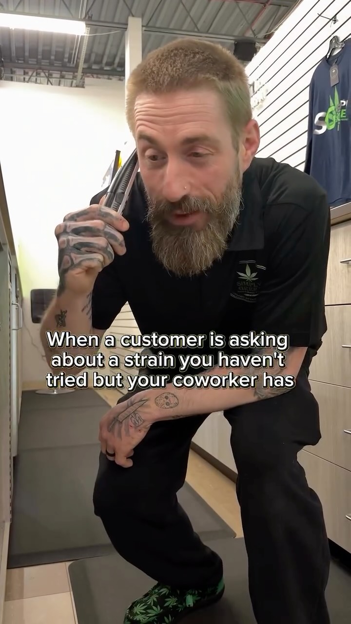 Simply Green budtender sharing strain knowledge with a customer