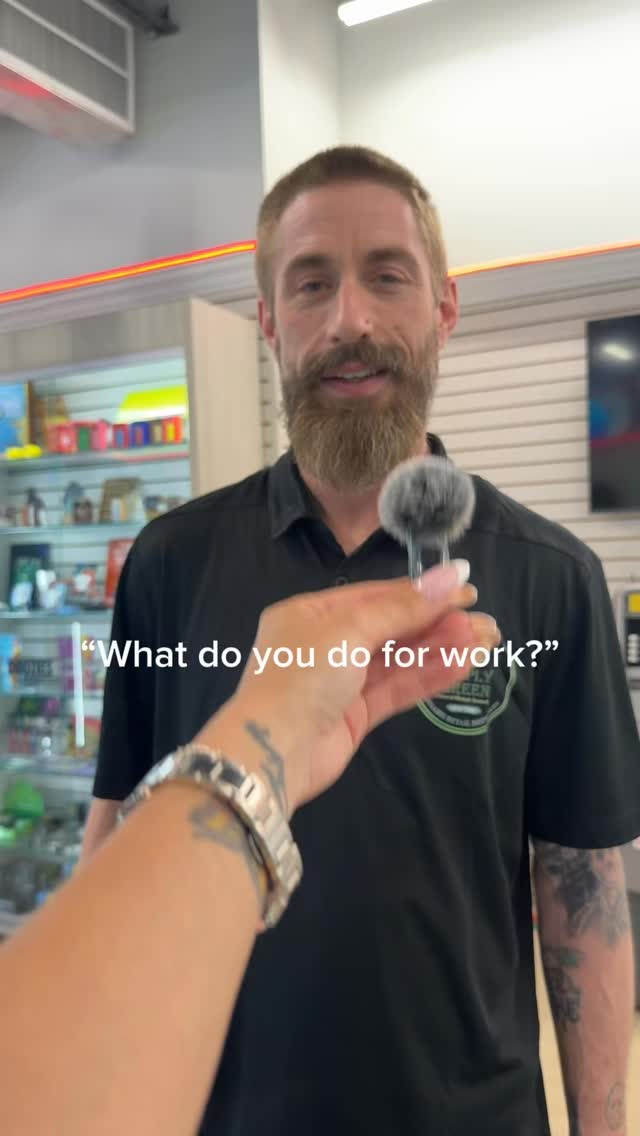 Simply Green team member helping a customer at the Coram dispensary